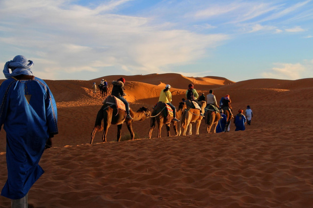 camel ride at sunset